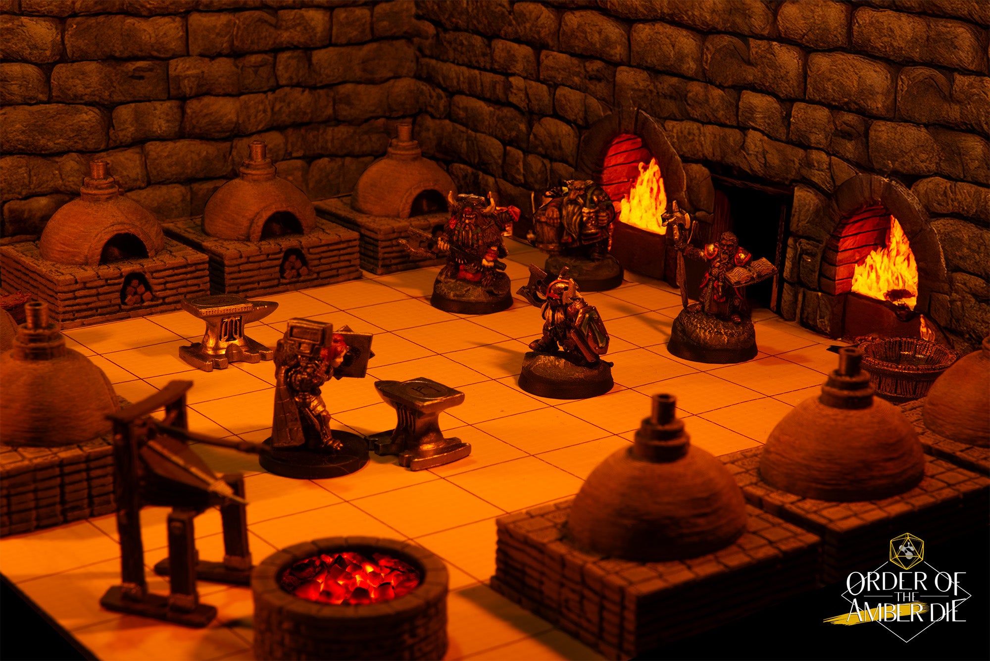 A tabletop miniature set of a lit forge in a dungeon. Half a dozen character miniatures stand at the fires or anvils as if they are working on metal weapons or armor.